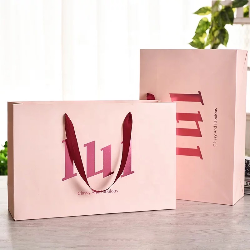 Custom printed retail paper bag with ribbon handle and hot foil