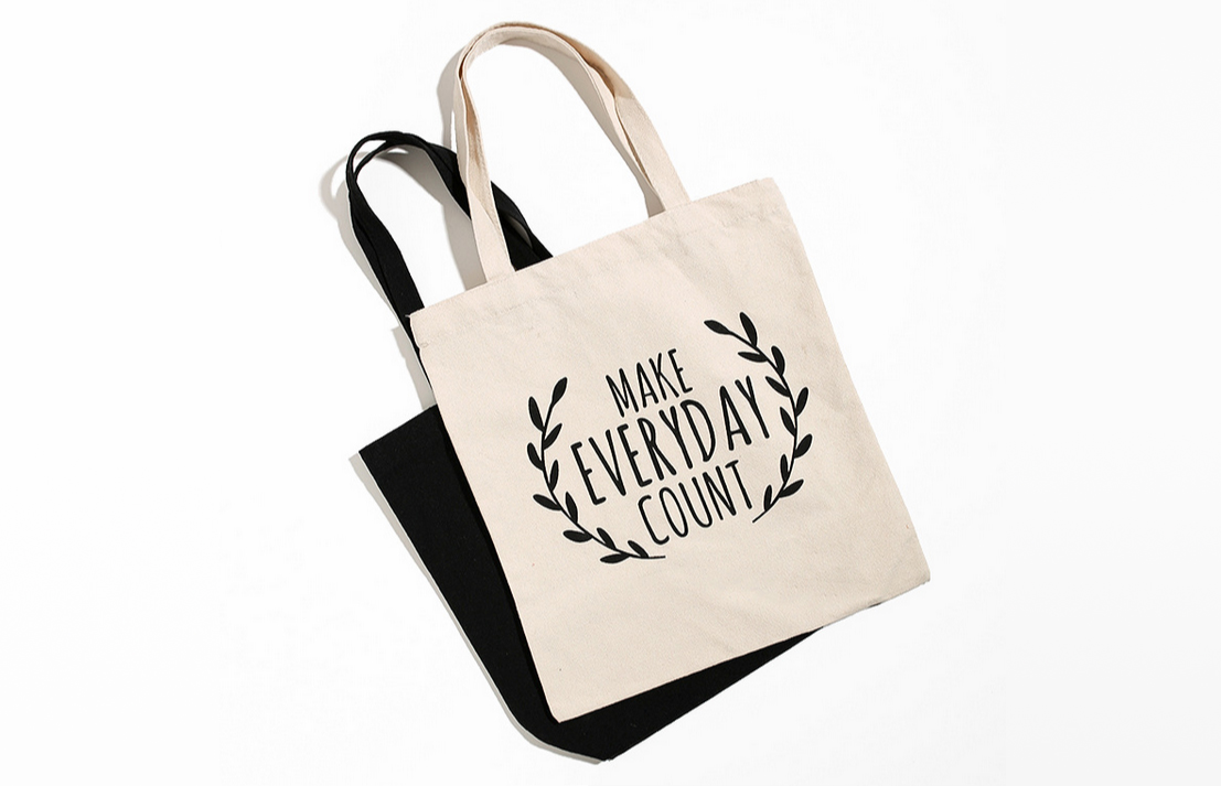 white and black printed tote bags