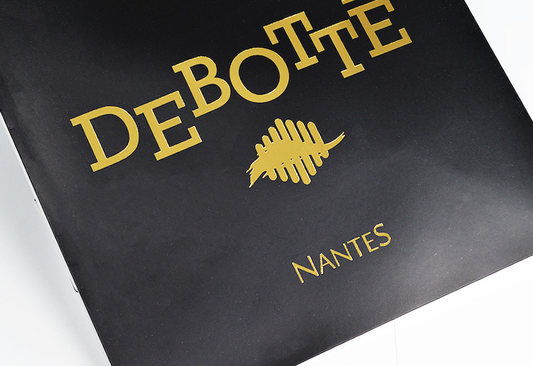 Custom printed black paper bag with gold foil logo