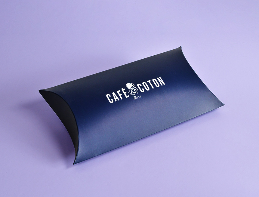 bespoke navy pillow box with white logo purple background