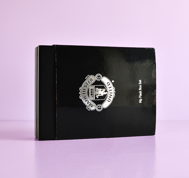 custom black gloss box with bespoke printed sleeve silver foil