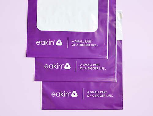 custom made purple mailing bags with white logo