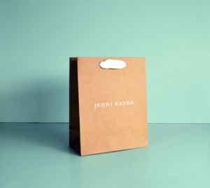 brown paper bag with white ribbon handle