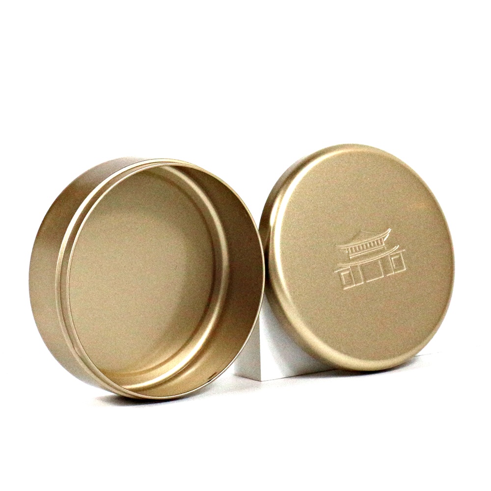 gold tins with embossed logo